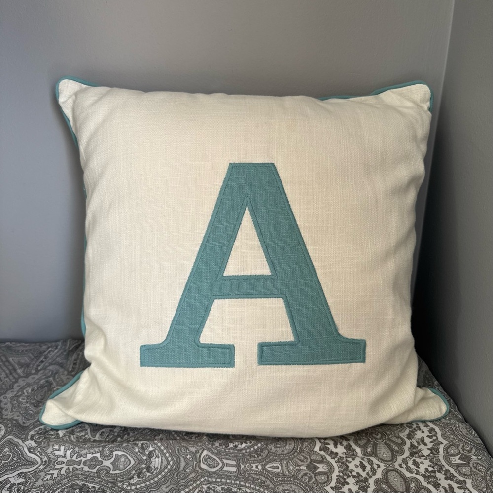 A Monogrammed Cream and Blue Throw Pillow